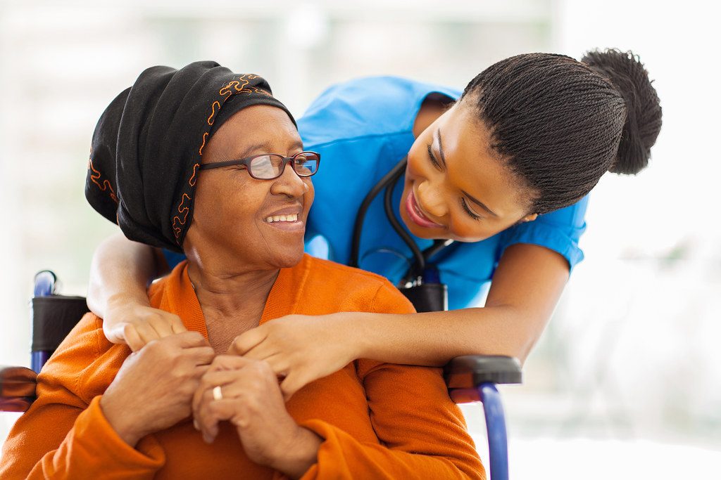 A caregiver embracing a resident